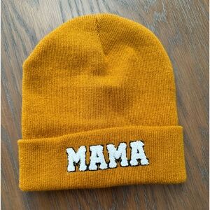 MAMA Beanie, mustard in color.